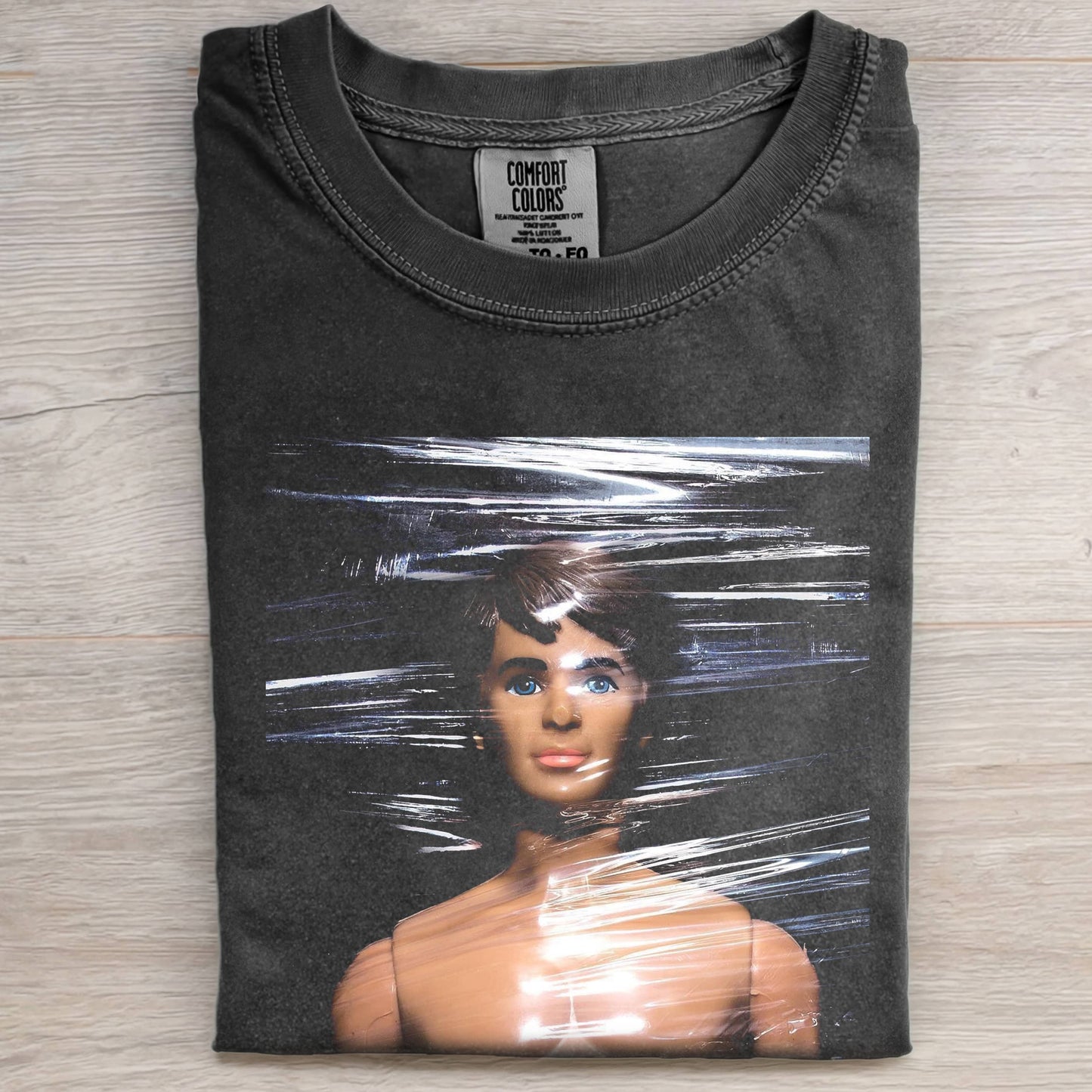 PLASTIC FILM DOLL FACE MEME TEE