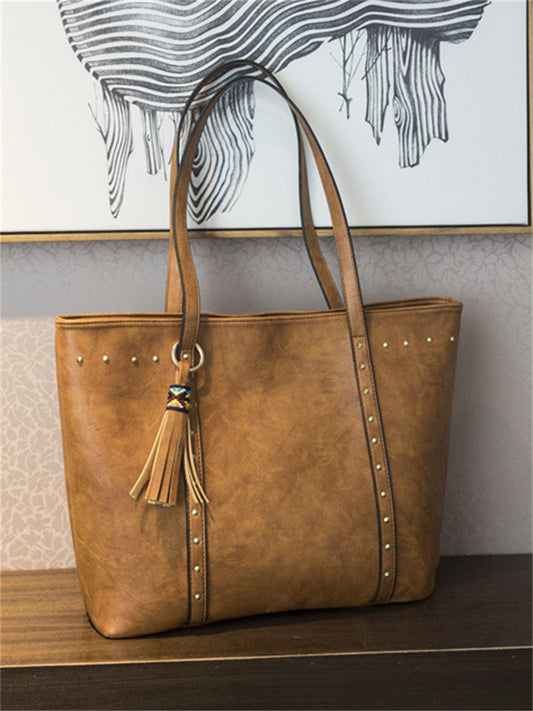 Ethnic Tassel Pendant Studded Shoulder Bag